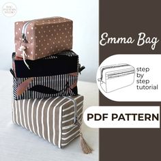 four pieces of luggage stacked on top of each other, with the text emna bag written