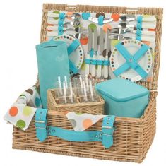 a picnic basket filled with utensils and plates