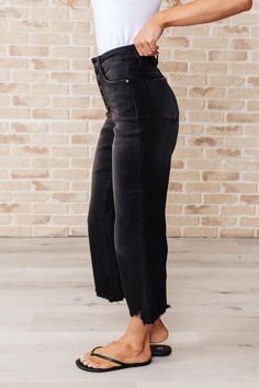 Get ready to rock stylishly with Ryan High Rise Jeans! These wide leg crop jeans feature a coordinating button fly and a washed out black garment dye for a cool, edgy look. With a high rise and raw hem, you'll stand out in the best way possible. **This item is a Drop Ship item which means it will ship from another facility. Estimated ship time is 8-10 business days to ship out. If you purchase multiple items you may receive them in multiple packages. Judy Blue High Rise Button Fly Garment Dyed W Judy Blue Jeans, Crop Jeans, Edgy Look, Sweater Blouse, High Rise Jeans, Cardigan Jacket, Dress Romper, Cropped Jeans, Jumpsuit Dress