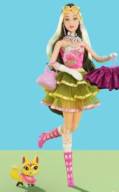 the doll is wearing a green dress and holding a pink purse while standing next to a toy