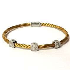 Classique Diamond Cable Bangle Bracelet Charriol Au750 Steel 3mm Gold Tone PVD Stainless Steel 3 18k White Gold Square Diamond Stations Approx .17 CTW Bead Set Diamonds Locking Magnetic Clasp Closure Exact Size & Fit As Shown Measured Excellent Preowned Condition Gold Cable Color Is Brighter Than Images Depict Worn Alone Or Stacked With Others Shown With Matching Single Station Bracelet Authenticity Guaranteed Listing Images Are Of The Actual Item Being Offered Free Shipping Within The United States Luxury Flexible Bangle For Anniversary, Flexible Luxury Bangle For Anniversary, Luxury Flexible Gold Diamond Bracelet, Fine Gold Bracelet With Single Cut Diamonds, Gold Flexible Diamond Bracelet Fine Jewelry, Luxury Gold Cuff Bracelet With Single Cut Diamonds, Flexible Gold Diamond Bracelet In Fine Jewelry Style, Flexible Gold Diamond Bangle, Luxury Gold Bangle With Single Cut Diamonds