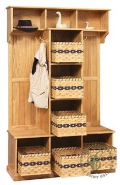 a wooden closet with baskets on the bottom shelf