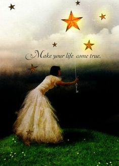 a woman in a white dress holding a string with stars on it and the words make your life come true