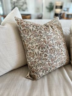 a close up of a pillow on a couch