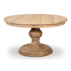 a round wooden table sitting on top of a white floor