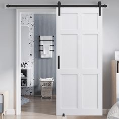 an open white sliding door in a bedroom