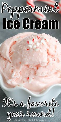 peppermint ice cream in a white bowl with candy canes on the side