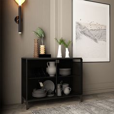 a black shelf with plates and vases on it next to a wall mounted painting