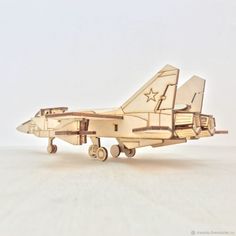 a wooden model of a fighter jet plane