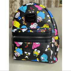 New! Loungefly Hello Kitty Sanrio Rainbow All Over Print Mini Backpack Material: Faux Leather Measurements: W 9" X H 10.5" X D 4.5" Wipe Clean Imported Black Kawaii Backpack For Everyday Use, Fun Black Standard Backpack, Cute Black Leather Bag, Playful Black Backpack For Everyday Use, Fun Black Bags For Back To School, Playful Black Bag For Back To School, Cute Leather Backpack, Playful Black Bag For Everyday Use, Fun Black Shoulder Bag For Travel