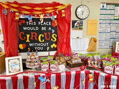 there is a circus themed birthday party set up on the table in front of it