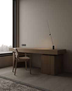 an empty room with a desk and chair next to a large window overlooking the city