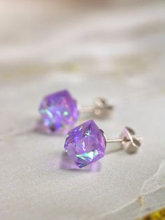 Purple Cube Earrings Dress up your ears with our mesmerizing Purple Cube Earrings! ✨ These statement studs are a celebration of modern elegance, carefully crafted to add a touch of glamour to any outfit. The iridescent allure of the resin material makes them the perfect choice for a Christmas gift or a thoughtful surprise for her. These stud earrings are not just accessories; they're a statement of individual style. Whether you're looking for everyday earrings or something special in purple, these colorful resin earrings fit the bill. Elevate your jewelry collection with these eye-catching cubes, a chic blend of sophistication and charm. 🎁👗 DETAILS - Fully handmade earrings - Made of epoxy resin and iridescent component - Zink clasp (silver is possible for the additional fee) - 8 - 10 mm Purple Sterling Silver Earrings For Party, Modern Purple Jewelry For Party, Modern Purple Earrings For Party, Purple Crystal Earings, Purple Resin Earrings As A Gift, Handmade Purple Resin Jewelry, Resin Cube Jewelry, Purple Resin Earrings, Resin Stud Earrings