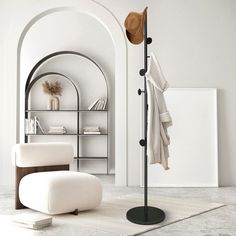 a white room with a chair, hat rack and bookshelf in the corner