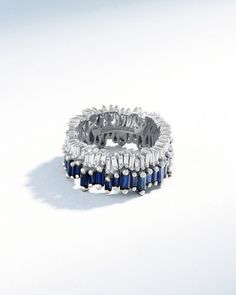 a ring with blue and white stones on it