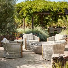 an outdoor seating area with chairs and tables