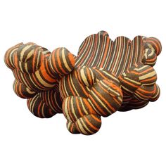 an orange and brown striped object on a white background