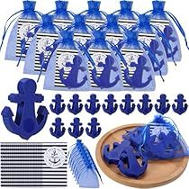 blue anchor shaped cookie cutters and decorations for a nautical themed birthday or baby shower