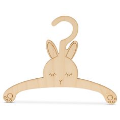 a wooden hanger with a bunny face on it