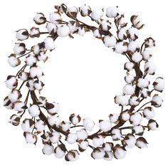 a round wreath made out of cotton and leaves on a white background with copy space in the middle