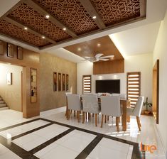 a dining room with white chairs and a flat screen tv