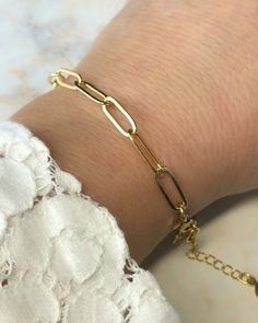 This paperclip chain link bracelet is made with 14K gold plating over brass. It is 7 1/2" long with a 1" extender chain. Hammered Copper Earrings, Porcelain Earrings, Gold Paper, Blue Pearl, Copper Earrings, Chain Link Bracelet, Paper Clip, Infinity Bracelet, Gold Plating