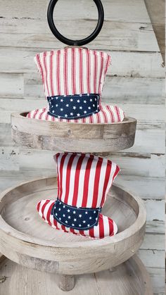 three patriotic pillows stacked on top of each other