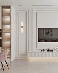 an elegant living room with white walls and wood flooring is furnished with modern furniture