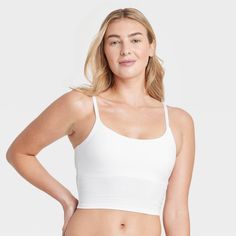 Give your everyday intimates a comfy upgrade with this Cotton Stretch Crop Cami Bralette from Auden™. This crop cami bralette is made of cotton jersey fabric with added spandex for a flexible fit that moves with you, while opaque lining provides extra coverage. The adjustable straps help you find the right fit, and unlined, wireless cups round out the design for support that maintains a natural, comfortable shape. Plus, removable padding provides a customized coverage. Auden™: Comfort true to ev Cotton Seamless Crop Top For Workout, Workout Seamless Cotton Crop Top, Stretch Cotton Crop Top Sports Bra, Medium Support Cami Sports Bra With Built-in Bra, Cotton Bra-friendly Crop Top For Workout, Seamless Camisole Crop Top For Loungewear, Supportive Cotton Workout Crop Top, Cotton Crop Top For Workout, Seamless Cropped Sports Bra For Loungewear