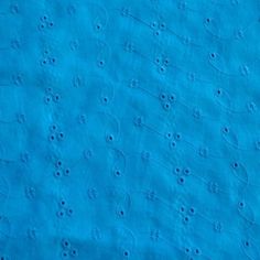 the blue fabric has small circles on it