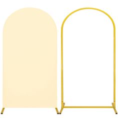 an arch stands next to a white board on a metal stand with two yellow poles