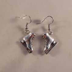 These Beautiful Ice Skate Skating Earrings Are Made Of Tibetan Silver And Are On Hypoallergenic Hooks That Won't Hurt Your Ears. They Are Brand New, Handmade And Have Never Been Worn. Lead And Nickel Free. Rubber Backs Included. These Fine Quality Earrings Are Perfect And Comfortable For All Day, Everyday Wear, Or A Special Gift. Get An $18 Gift Of Your Choice In My Listings With Purchase Of Two Or More Items. Please Send Offers And Questions. Charm: 18x18mm Or .70" X .70" Ice Skate, All Day Everyday, Ice Skating, Special Gift, Skating, Special Gifts, Silver Jewelry, Everyday Wear, Jewelry Earrings