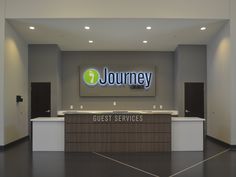 the front desk of a business is shown in this photo, with its name on it