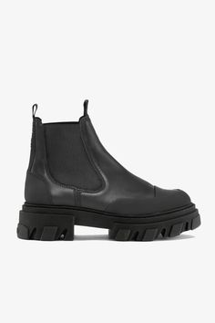 These Black Stitch Cleated Low Chelsea Boots feature elastic panels, toe cap details, pull tabs, chunky cleated soles and a subtle GANNI logo. GANNI Black Stitch Cleated Low Chelsea Boots | Women's Size 8 Black Stitch, Size 12 Women, Chelsea Boots Women, Floral Bags, Shoulder Backpack, Floral Shoes, Size 8 Women, Black Chelsea Boots, Buckle Shoes