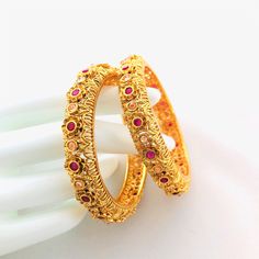 "2.6 Ruby Kundan Kada/Golden Kundan bangles/Handcarved Bangles/Jadau Bangles/Kundan Bridal bangle/Kundan wedding jewelry@AryaFashions This bangles set is handcrafted with love and creativity and are perfect for any occasion may it be engagement, Wedding or any bridal ceremonies or social get-together. Pair them up with Indian traditional outfit such as Anarkalis, Lehengas or Sarees and be the \"Diva\" at your next special occasions, or party. Handcrafted To Perfection Light Weight Perfect For In Wedding Filigree Bangle Jewelry, Fusion Style Bracelet For Wedding And Diwali, Fusion Style Wedding Bracelet For Diwali, Festive Filigree Wedding Bracelets, Fusion Style Bangle With Intricate Design For Celebrations, Fusion Style Celebration Bangle With Intricate Design, Wedding Filigree Bangle, Fusion Style Bangle For Wedding And Diwali, Fusion Style Meenakari Bangle For Wedding