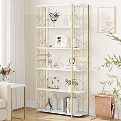 a white and gold bookcase in a living room