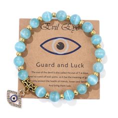 Step into a world of protection and style with our 8MM Beaded Trendy Evil Eye Charm Bracelet. Adorned with natural stone beads and the symbolic Evil Eye charm, this bracelet is a fashionable and meaningful accessory that wards off negativity. Key Features: Evil Eye Charm: A symbol of protection, the Evil Eye charm shields against negative energy and brings good fortune. 24 Crystal Variants: Choose from a wide array of crystal variants, each with its unique energy, allowing you to personalize you Good Luck Adjustable Beaded Bracelets With Natural Stones, Gift Evil Eye Bracelet With Gemstone Beads, Evil Eye Bracelet With Gemstone Beads As Gift, Evil Eye Bracelet With Round Gemstone Beads, Healing Beaded Evil Eye Bracelet With Round Beads, Spiritual Beaded Bracelets With Natural Stones For Good Luck, Spiritual Beaded Evil Eye Bracelet For Healing, Healing Beaded Evil Eye Bracelet, Healing Evil Eye Beaded Bracelet