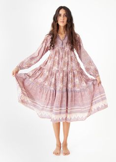 The Yamini dress embodies a re-envisioned interpretation of classic Indian textiles. This dress is part of an ongoing series that exudes a vintage vibe with a current edge and a relevant color story. Inspired by the many years that Cristina Gitti, the designer, spent traveling through and working in India. Block Printed Cotton Voile 100% Cotton | Made in India Hand wash in cold water with mild detergent and hang to dry Bohemian Long Dress For Daywear, Long Sleeve Boho Dress For Daywear, Vintage Mid-length Dresses, Bohemian Knee-length Mini Dress For Daywear, Bohemian Flowy Mid-length Dress, Vintage Flowy Long Sleeve Mini Dress, Flowy Bohemian Mid-length Dress, Bohemian Mid-length Dress, Flowy Long Sleeve Vintage Mini Dress