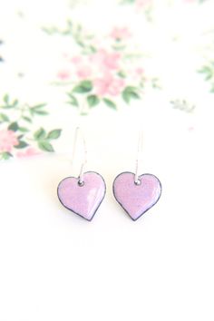 These beautiful pink heart earrings handmade with enamel on copper would make a lovely girl friend gift this Galentines day. The baby pink earrings measure approximately 13mm in diameter and are fired using pastel pink enamel which creates a subtle glazed finish. The copper earrings are backed with counter enamel to insure comfort and strength. They come complete with 925 Sterling silver earring wires. All jewellery comes packed in a quality iamrachel box, just add a bow and they're ready for gi Small Pink Earrings For Gifts, Pink Hand Painted Heart Jewelry, Everyday Hand Painted Pink Earrings, Pink Heart-shaped Nickel-free Earrings, Pink Round Heart Earrings For Valentine's Day, Hypoallergenic Pink Heart Earrings, Hypoallergenic Heart-shaped Pink Earrings, Pink Heart-shaped Everyday Earrings, Pink Heart Earrings For Everyday