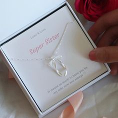 - Elegant bow necklace perfect as a Birthday gift - Silver bowknot design necklace  - Thoughtful gift for sister - The perfect gift for your sister to show her how much she means to you Silver Ribbon Necklace For Gift, White Ribbon Necklace For Gift, Valentine's Day Bow Jewelry Gift, White Jewelry With Bow For Gifts, Sterling Silver Ribbon Jewelry For Gifts, Sterling Silver Jewelry With Ribbon For Gift, Adjustable Necklace For Gift Occasions, Adjustable Necklace For Gifts, Adjustable Ribbon Necklace For Gift