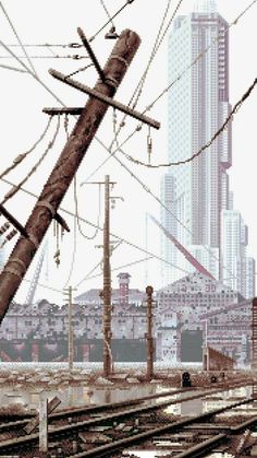 an image of a train track with power lines in the foreground and buildings in the background