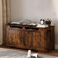 a wooden bench sitting in the middle of a living room