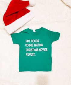 Match With Your Little This Christmas! Child's Shirt NB- 24M are bodysuit 2T-14 Youth are tshirts 100% combed ringspun cotton fine jersey Topstitched ribbed collar Adult Shirt Heathers: 4.2 oz., 52/48 Airlume combed and ringspun cotton/polyester, 32 singles Solids 100% ringspun cotton Athletic Heather & Black Heather are 90/10 airlume combed and ringspun cotton/polyester Unisex sizing Coverstitched collar and sleeves Shoulder-to-shoulder taping Washing Instructions: Wash on cold and delicate Fun Christmas T-shirt For Holiday, Festive Green Short Sleeve Top, Green Christmas T-shirt For Holiday, Green Cotton Christmas Tops, Christmas Green Cotton Tops, Green Cotton Top For Holidays, Green Cotton Holiday Top, Funny Christmas Holiday Tops, Green Cotton Christmas Shirt