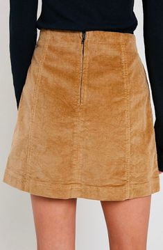 Corduroy is back in style! This mini skirt is perfect for this occasion, featuring a panel design and having a back zipper. Pair this skirt with a long sleeved top and some knee high boots for the perfect fall look. 98% cotton, 2% spandex Hand Wash Cold. imported S M L WAIST 28" 29" 30" HIP 36" 37" 38" LENGTH 16" 16.5" 17" Corduroy Skirt For Fall Workwear, Fall Corduroy Skirt For Workwear, Corduroy Lined Skirt Bottoms For Fall, Fall Corduroy Mini Skirt With Lining, Trendy Winter Corduroy Mini Skirt, Cotton Mini Skirt For Fall, Fall Knee-length Cotton Skirt, Trendy Corduroy Mini Skirt For Winter, Fall Cotton Knee-length Skirt