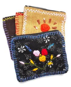 three different types of purses with flowers on them