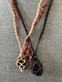 These one of a kind Hemp macramé necklaces come in three colors: black, brown and tan, with one Obsidian stone. The necklace is 12-13 inches in length. None are exactly the same!! When you receive your necklace, it will be prefilled with one Obsidian crystal and will arrive safely in a pretty mesh pouch. Also included are crystal care and cleansing instructions along with a crystal properties card. All the Crystals I sell are cleansed, charged & well cared. They're perfect for metaphysical uses, Crystal Rope Necklace, Handmade Black Earthy Jewelry, Bohemian Black Macrame Necklace, Black Crystal Necklace With Adjustable Cord, Handmade Adjustable Black Crystal Necklace, Adjustable Handmade Black Crystal Necklaces, Spiritual Black Crystal Necklace With Adjustable Cord, Adjustable Black Earthy Jewelry, Black Bohemian Crystal Necklaces With Natural Stones