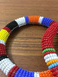 "Here is a set of three (3) gorgeous bangle bracelets from the Maasai tribe in Kenya. Black seed beads are accented with gold geometric pattern and colorful stripes. Bracelets measures approx. 2-1/2\" inside diameter. A wonderful gift to give to that someone special or to keep for yourself! NOTES: ~I make every attempt to list and picture any flaws within all of my item descriptions, such as any prominent chips, cracks, stains, discoloration or missing elements. Please refer to pictures, as they African Beaded Bracelets, Gold Geometric Pattern, Hand Beaded Necklace, Beaded Bangles Bracelets, Native American Necklace, Glass Bead Bracelet, Bead Bangles, Black Seed, Maasai