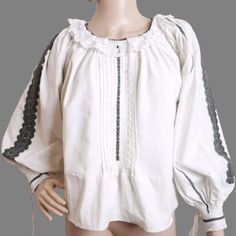 Romanian ethnic shirt, handmade folk blouse from Transylvania. Hand embroidered with black  cotton thread  on hand-woven fabric. Wide  puffy sleeves finished with cuffs. Lace collar around the neck. Age: 50-80 years or more  Condition: good, clean, prolonged, ready to wear. But the embroidery is discolored and there are a few difuse spots on one sleeve , very pale to be captured in photos . It looks like a very old shirt. Measure M-L: shirt length: 55 cm or 21.65 inches sleeve length measured from neck : 66 cm or 26 inches chest circumference: 120 cm or 47.24 inches' Good arm hole size . ( code 3 ) We accept returns and  the buyer pays for return shipping for old, vintage or antique products that we sell in our store. Spring Folk Blouse With Woven Motifs, Long Sleeve Peasant Top For Festivals, Peasant Style Long Sleeve Embroidered Top, Traditional Embroidered Tunic Peasant Top, Peasant Style Embroidered Tunic Top, Folk Style Peasant Top With Boho Collar, Peasant Style Cotton Blouse With Yoke, Traditional Long Sleeve Peasant Top With Intricate Embroidery, Traditional Long Sleeve Cotton Peasant Top