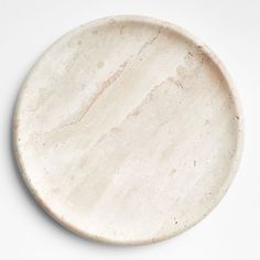 a white marble plate sitting on top of a table