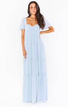 A winning combination of all our bestselling moments, this flattering maxi has a sweetheart neckline with a smocked back to ensure a perfect fit on your bust. Flutter sleeves offer dainty coverage and a tiered skirt adds the ultimate boho flow! The empire waist makes this a great maxi dress for moms to be! So whether you're a bridesmaid or a momma with a special event to attend, the Nicole will take care of you. Blue Maxi Dresses, Steel Blue Bridesmaid Dresses, Light Blue Bridesmaid Dresses, Light Blue Bridesmaid, Pastel Bridesmaid Dresses, Maternity Bridesmaid Dresses, Dresses Silk, Dusty Blue Bridesmaid Dresses, Maxi Outfits